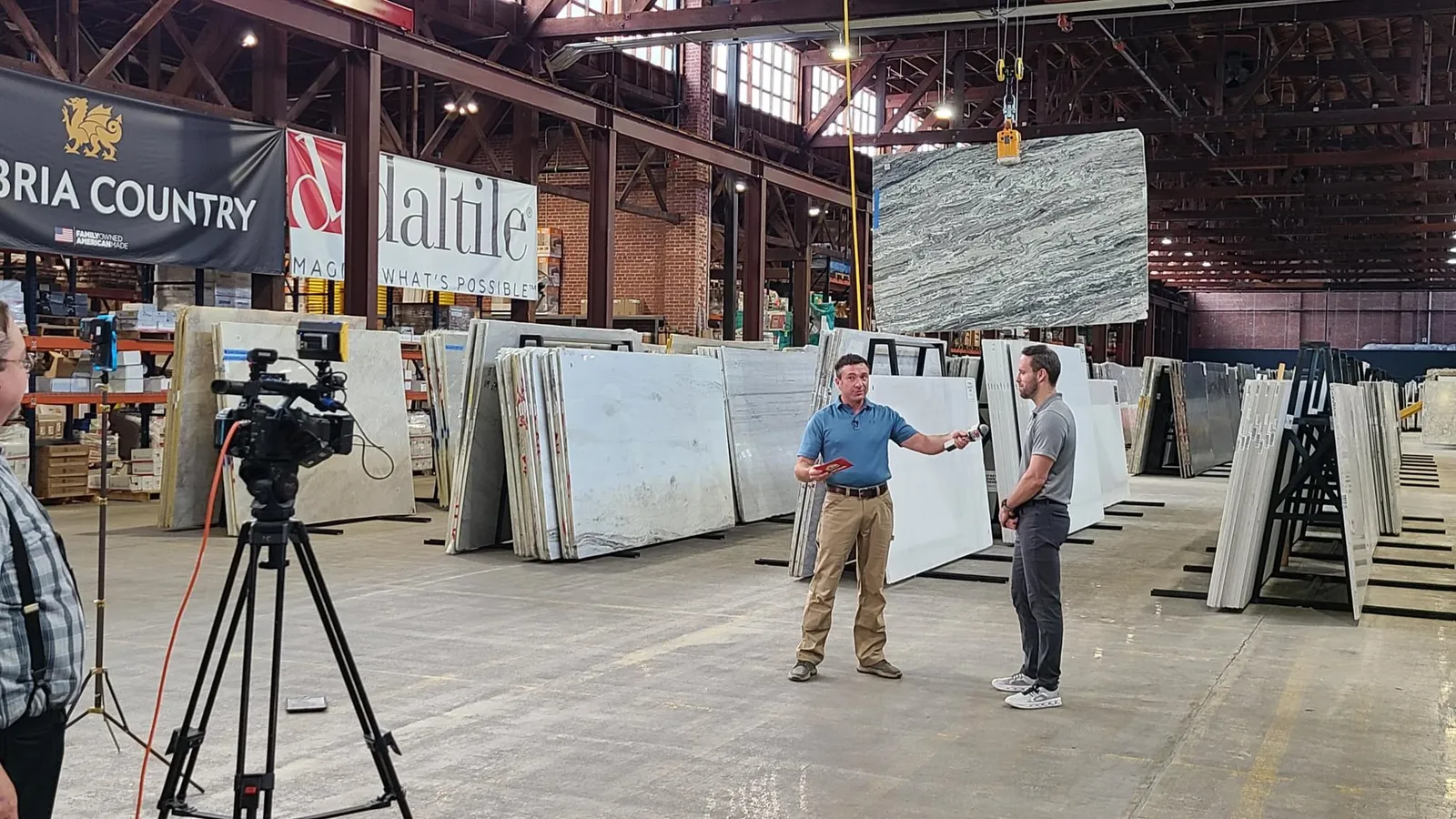 An interview being filmed among the slabs in the slab gallery.