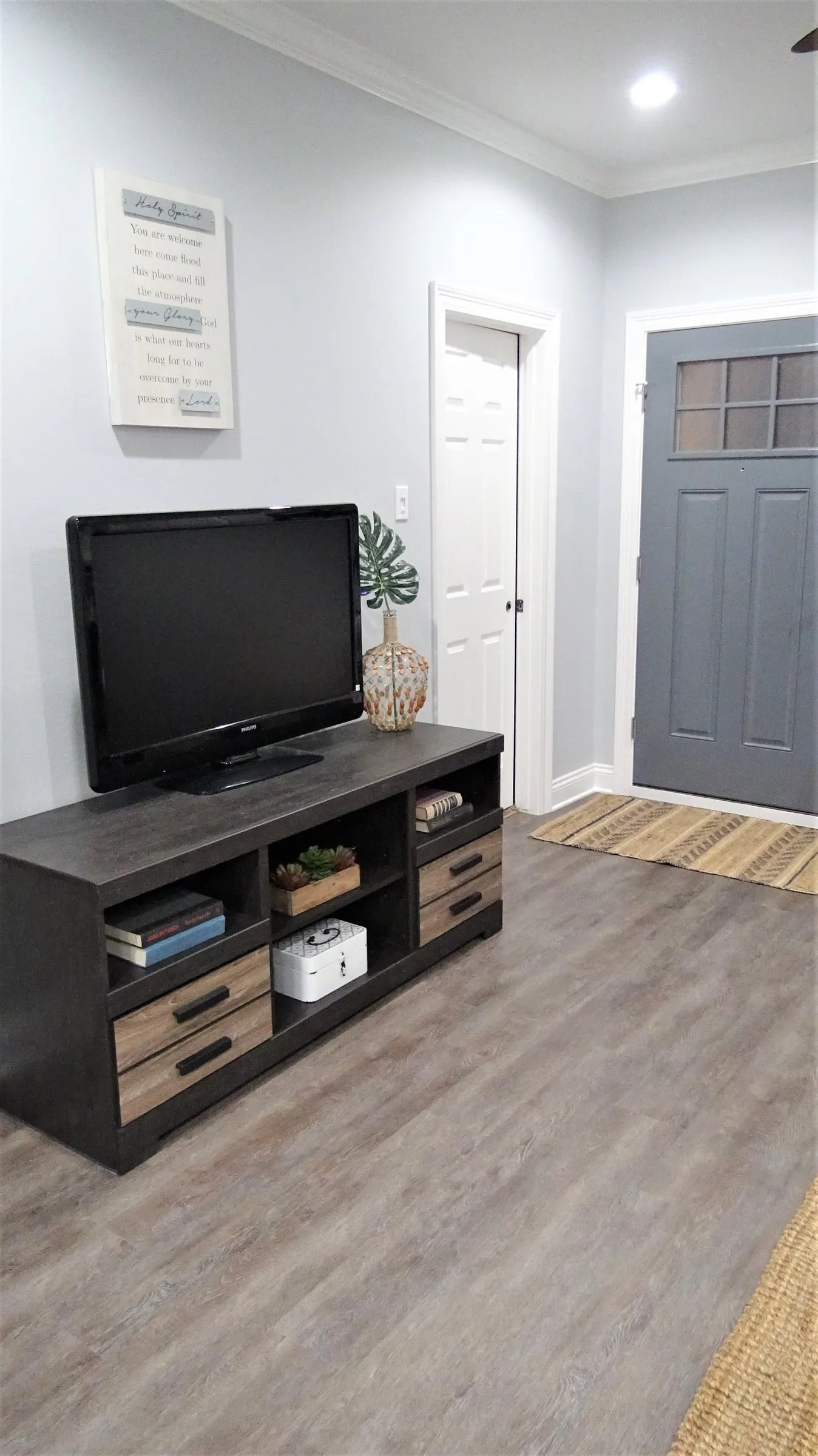 Gray wood-look floor running into the living area.