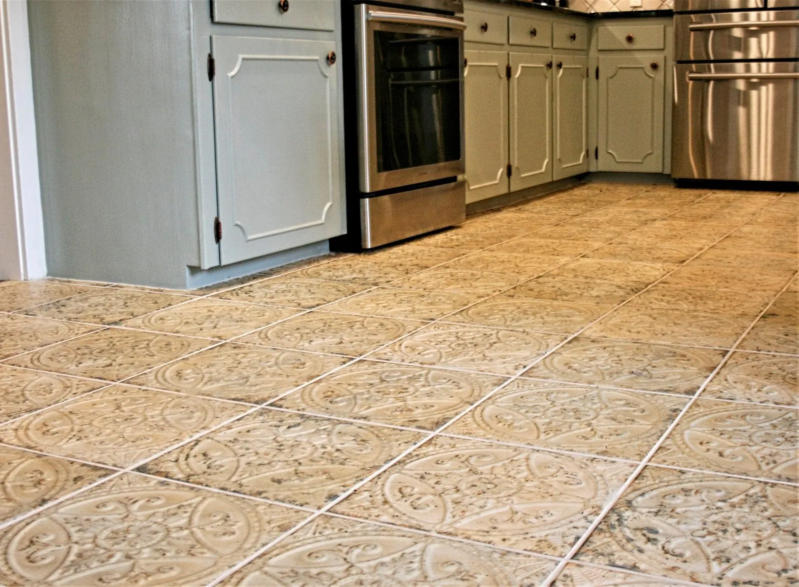Patterned cream tile floor running through the kitchen.