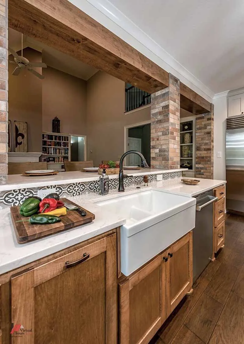 Close-up of the farmhouse sink and brick-look tile column.