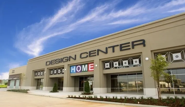 The Design Center building on Fern Loop, with “Design Center” in large letters and “Home” in colored tiles over the entrance.