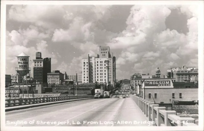 Vintage black-and-white postcard of downtown Shreveport seen from the Long-Allen Bridge.