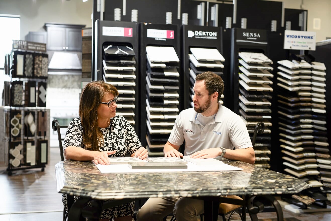 Anthony with client discussing countertops and tile Classic STone United tile company shreveport bossier