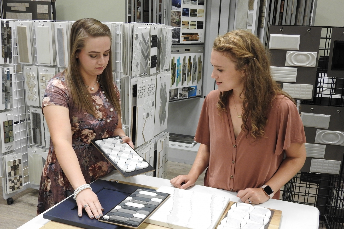 Designer Mallory helping client match backsplash to cabinet selection